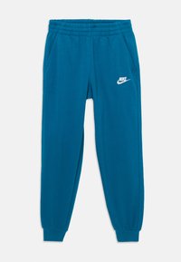 Tīrkīza kokvilnas sporta bikses ar elastīgu jostu, sānu kabatām un ribotām aprocēm. Uz kreisā augšstilba ir balta Nike logo.