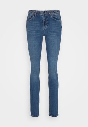 Blue denim jeans with a slim fit, featuring a textured waistband and a classic five-pocket design. Clean, straight leg with subtle fading.