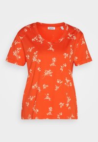Kortærmet t-shirt med v-hals i livlig orange, prydet med et blomstermønster i creme. Lavet af blødt stof med en afslappet pasform.
