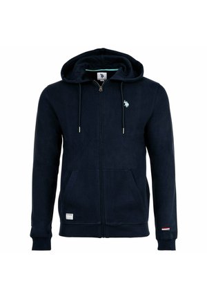 Marineblauer Kapuzenpullover mit Reißverschluss, Fronttaschen, Kordelzug in der Kapuze, kleinem weißem Logo auf der Brust und einem kleinen Flaggenaufnäher am linken Ärmelbündchen.