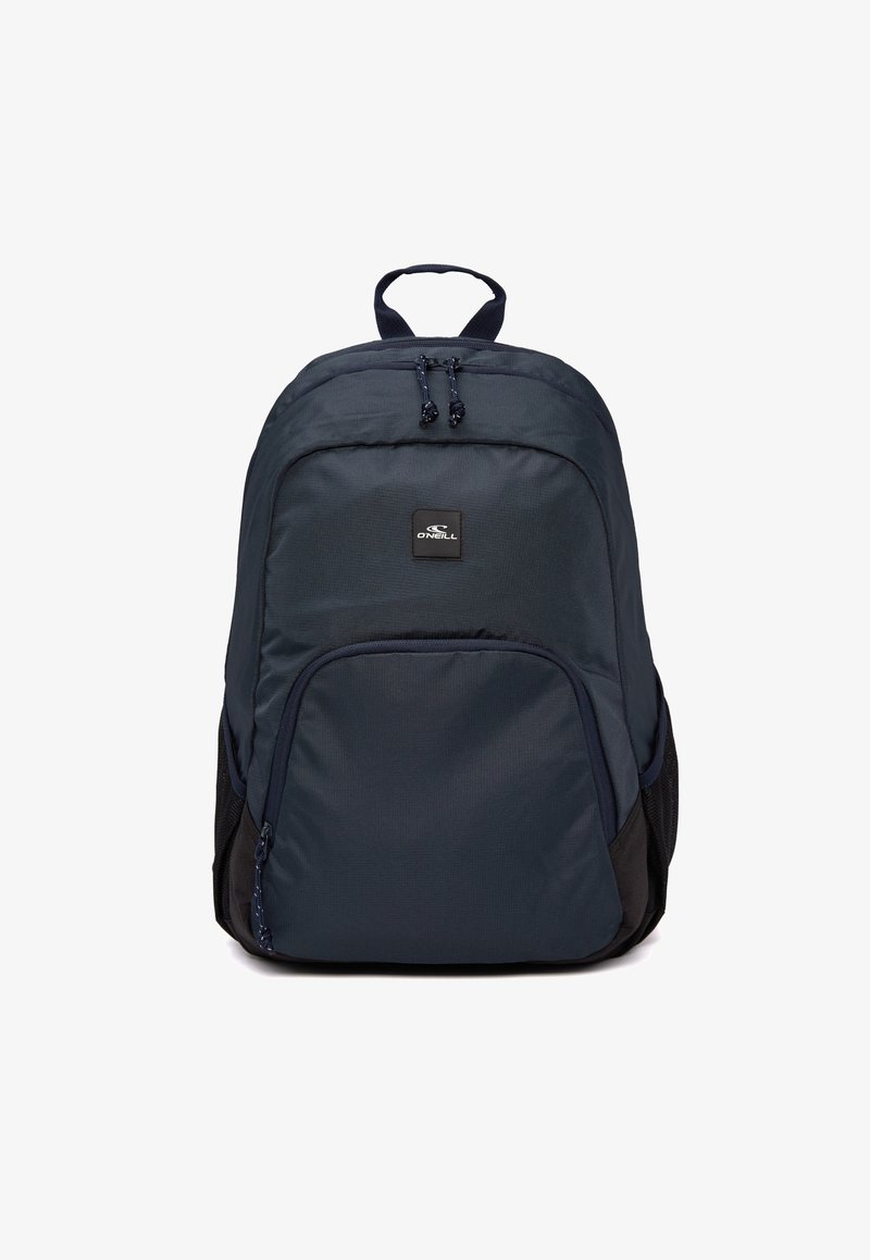 Navy backpack made of durable fabric features a large main compartment, front zipper pocket, and side mesh pockets. Retractable carry handle included.