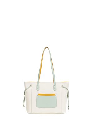 Sac cabas crème avec poche avant vert menthe, intérieur jaune et longues anses vert menthe sur fond blanc.