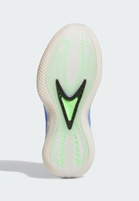 Podeszwa sportowego buta z falistym wzorem bieżnika, przezroczystą białą podstawą i neonowo zielonym oraz czarnym akcentem w kształcie trójkąta na środku.