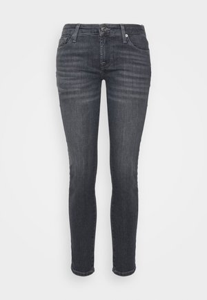 Dark gray skinny jeans, made of denim, feature a button closure, five pockets, and subtle fading along the thighs.
