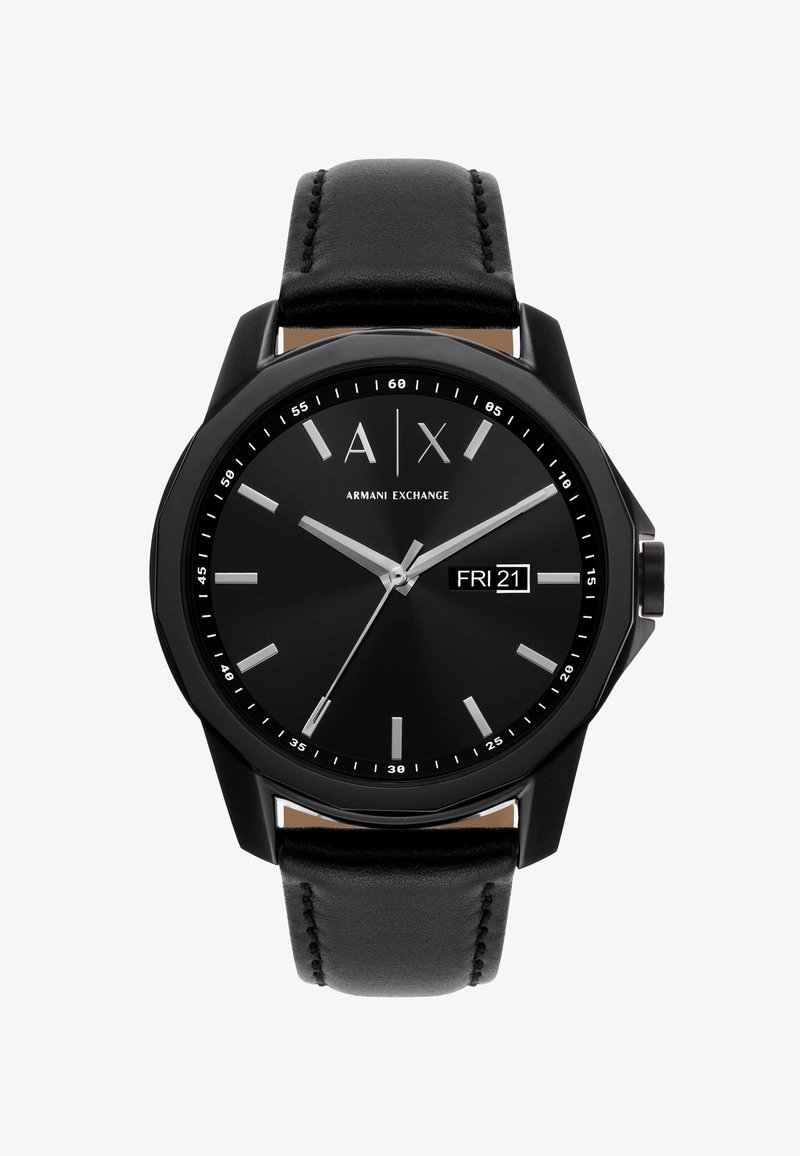 Black Armani Exchange wristwatch with leather strap, silver hour markers, three hands, and digital day-date display showing "FRI 21."
