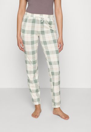 Lightweight, cream-colored pajama pants with a green and pink plaid pattern, featuring an elastic waistband and adjustable drawstring.