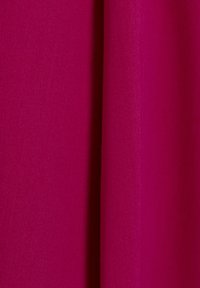 Fuchsia fabric displaying a smooth texture, with a slightly ribbed appearance and consistent color throughout, showcasing even draping.