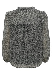 Blouse noire transparente à manches longues avec motif floral blanc, encolure froncée et poignets élastiques, vue de dos.