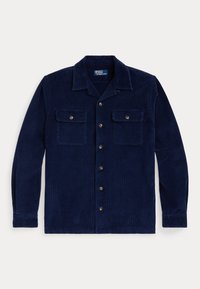 Camisa de corduroy azul marino con cuello, dos bolsillos en el pecho y botones en tono dorado, que presenta un tejido texturizado y un corte relajado.