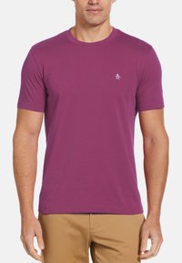 Short-sleeve purple cotton t-shirt with a round neckline and a small white penguin logo on the left chest. Smooth texture.