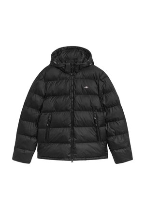 Giacca a vento nera trapuntata con cappuccio attaccato, zip frontale, due tasche con zip e piccolo logo sul petto.