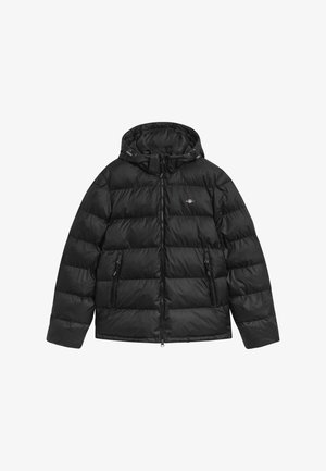 Black quilted puffer jacket with attached hood, front zipper, two zippered pockets, and small logo on the chest.