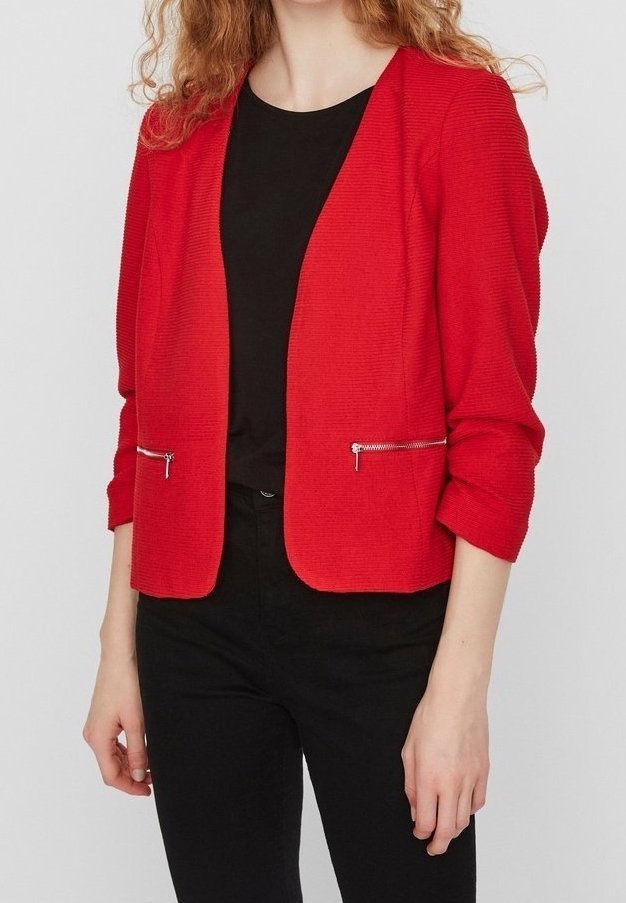 Red tailored blazer with long sleeves, textured fabric, open front, and silver zippered pockets. Worn over a black top and dark pants.