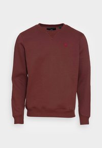 Sudadera color granate hecha de tela suave, con cuello redondo, puños acanalados y un pequeño logo en el pecho. Diseño simple y limpio.