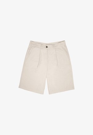 Beige lühikesed püksid pehmest kangast, sileda esiotsaga, kahe voltiga, vöödega ja küljetaskutega. Üksik nööp sulgemiseks vöökohtadel.