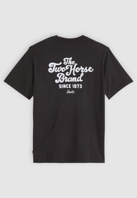 Černé bavlněné tričko s bílým potiskem na zádech: "The Two Horse Brand Since 1873 Levi's." Klasický design s kulatým výstřihem.