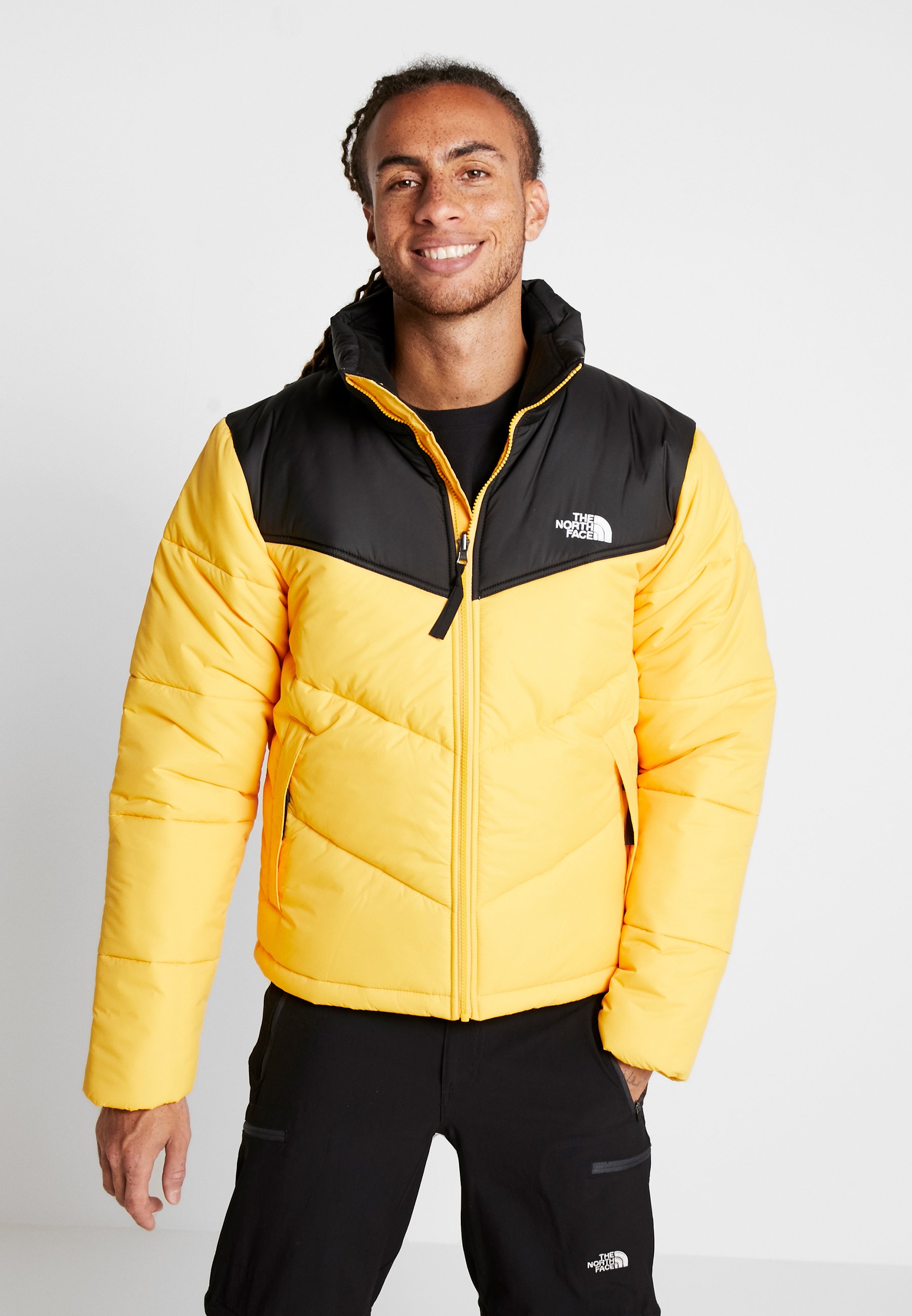 yellow and black north face jacket