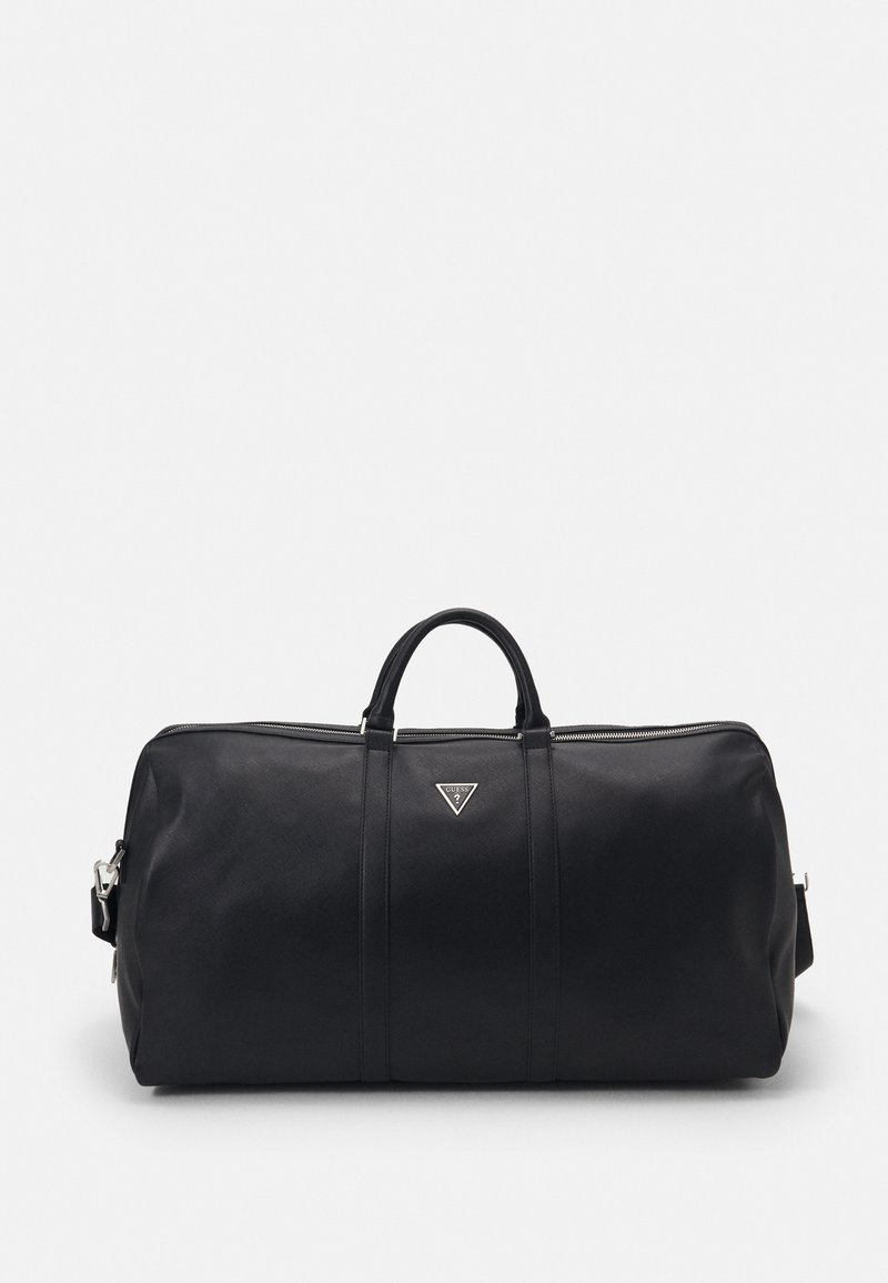 Black leather duffel bag with a zip closure, two top handles, adjustable shoulder strap, and silver logo on the front. Smooth texture.