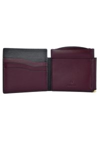 Leather wallet in burgundy and black, featuring card slots, a coin pocket, and embossed branding. Smooth texture with stitched edges.