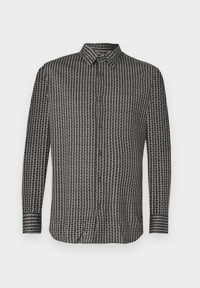 Juoda ir balta marškinėliai su geometriniu raštu, ilgomis rankovėmis, užsegami mygtukais ir, su apykakle. Pagaminti iš lygaus audinio.