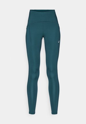 Leggings teal a vita alta realizzati in tessuto elasticizzato, con vita sagomata, tasca laterale e discreto logo vicino all'anca.