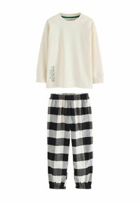 Haut à manches longues crème avec imprimé vert et col rond, associé à un bas de pyjama à carreaux noir et blanc avec ceinture élastique.