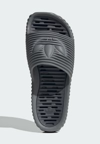 Gray slide sandal with a textured upper and ridged design. Features an open toe and patterned sole with drainage holes for grip.