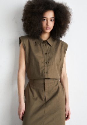 Olive green, sleeveless button-up shirt with a collar, paired with a matching high-waisted skirt. Textured fabric, tailored fit.