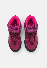 Magenta hiking boots with pink accents, textile upper, rubber sole, stylish laces, and a plastic toggle for tightening.