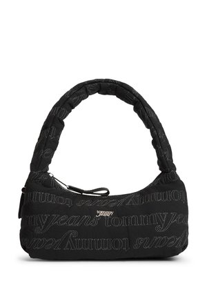 Black padded shoulder bag with stitched "Tommy Jeans" text pattern and silver Tommy Jeans logo on front, zipper closure on top.