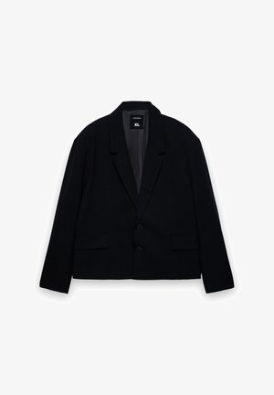 Blazer nero corto con rever a incavo, due tasche frontali e due bottoni. Realizzato in tessuto strutturato, taglia XL.