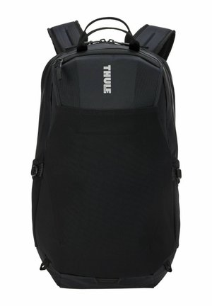 Sac à dos Thule noir avec bretelles rembourrées, poignée supérieure, compartiments zippés et grande poche avant en filet.