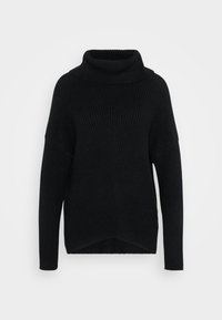 Svart ribbad stickad turtleneck-tröja med långa ärmar och sjunkna axlar, något längre bakstycke, uppvisad på en enfärgad vit bakgrund.
