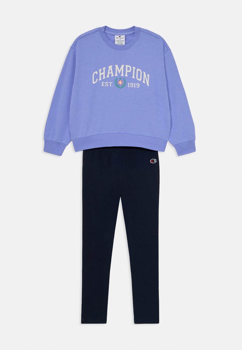 Light purple sweatshirt with "Champion" text and logo, paired with black fitted leggings, both made of cotton blend fabric.