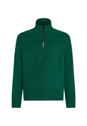 Zelený fleecový pulovr s vysokým zipem na límci. Obsahuje černý zip a černé logo "Polartec" na rukávu. Měkká textura.