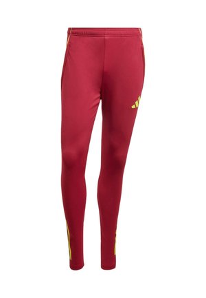 Leggings atletici rossi in materiale sintetico, con strisce laterali gialle e logo Adidas sulla gamba sinistra. Design aderente.