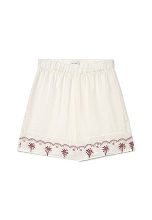 Short blanc à taille élastique avec tissu texturé et broderie marron de palmier le long de l'ourlet.