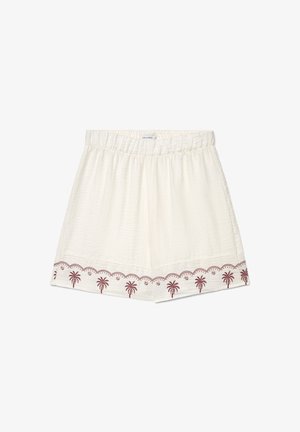 Weiße Shorts mit elastischem Bund, strukturiertem Stoff und brauner Palme-Stickerei am Saum.