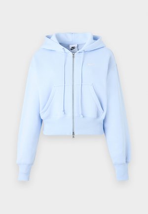 Világoskék Nike cipzáras kapucnis pulóver elülső zsebekkel, húzózsinóros kapucnival, bordázott mandzsettával és kis Swoosh logóval a mellkasán.