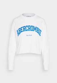 Weißer, taillierter Langarm-Sweatshirt aus Baumwolle. Blaue Schrift mit "ABERCROMBIE" über "New York". Verfügt über einen klassischen Rundhalsausschnitt.