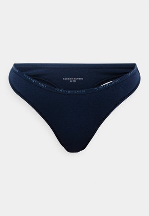 Tummansininen puuvillapanta, jossa on sileä pinta ja brändätty joustava vyötärö, jossa on hienovaraisesti teksti "TOMMY HILFIGER".