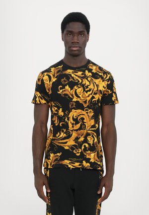 Black short-sleeve t-shirt featuring an intricate gold baroque pattern. Made from soft fabric, it has a classic crew neck design.