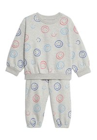 Grauer Sweatshirt- und Hosenanzug mit Smiley-Gesicht-Motiven in Blau und Rot, aus weichem Stoff mit elastischen Bündchen und Taillenbund.