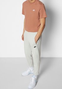 Nike Sportswear Träningsbyxor - silver-coloured