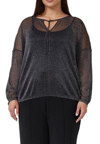 Schwarze, strukturierte Bluse mit durchsichtigen langen Ärmeln, einem dezenten Schimmer und einem Bindeband am Ausschnitt mit einem offenen Schlüsselloch-Design.