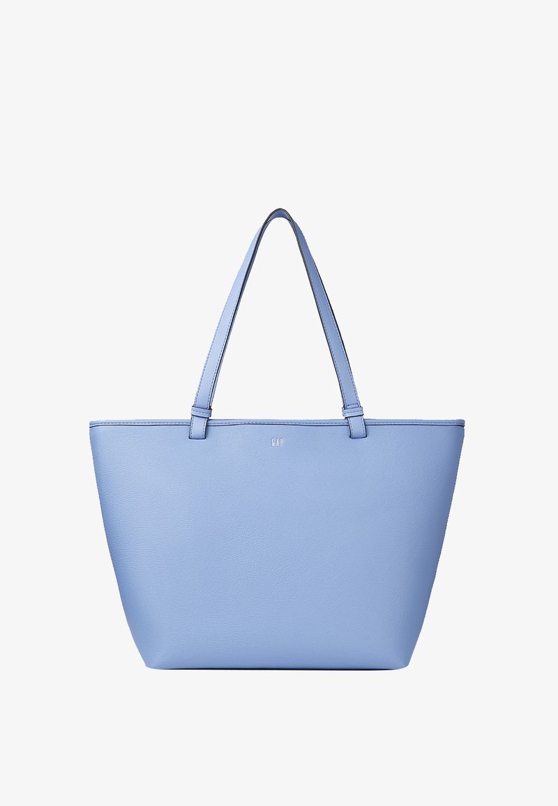 Sac fourre-tout en cuir bleu clair avec deux bretelles et petit logo embossé au centre devant.