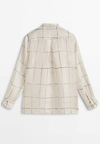 Lys beige langærmet skjorte med et rutenetmønster i mørkebrune nuancer, med krave og knapmanchetter, lavet af et struktureret stof.