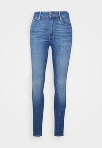 Jeans skinny de mezclilla azul con cintura alta, que cuentan con una cremallera en la parte delantera, diseño de cinco bolsillos y un desvanecimiento sutil para un aspecto desgastado.