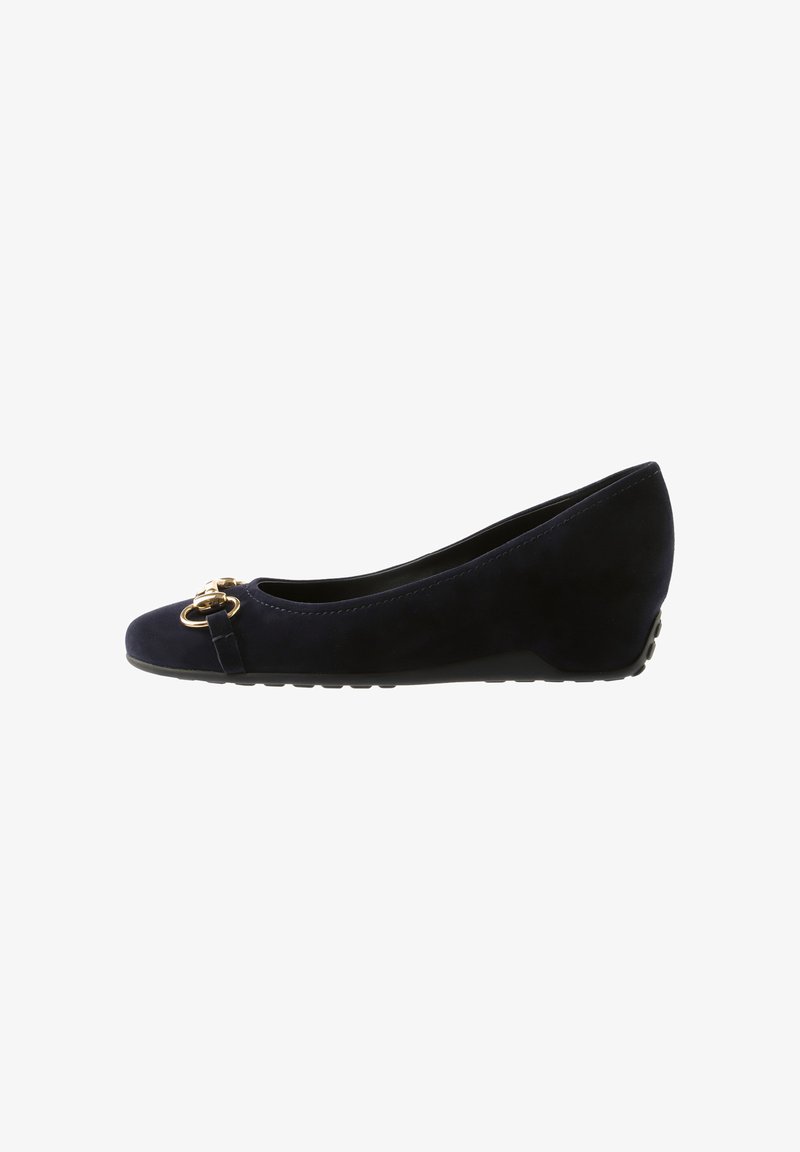 Navy blue suede ballet flat with a rounded toe, featuring gold-tone hardware accents and a textured rubber sole. Wedge heel design.