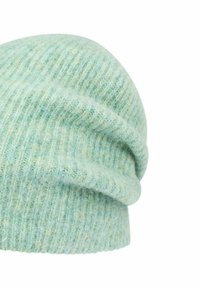 Light green ribbed knit beanie hat with a soft, fuzzy texture and a folded cuff on a white background.